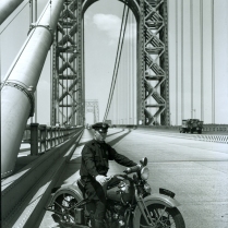 One of the new officers assigned to the George Washington Bridge Command sits astride a Harley Davidson "Knucklehead" motorcycle.